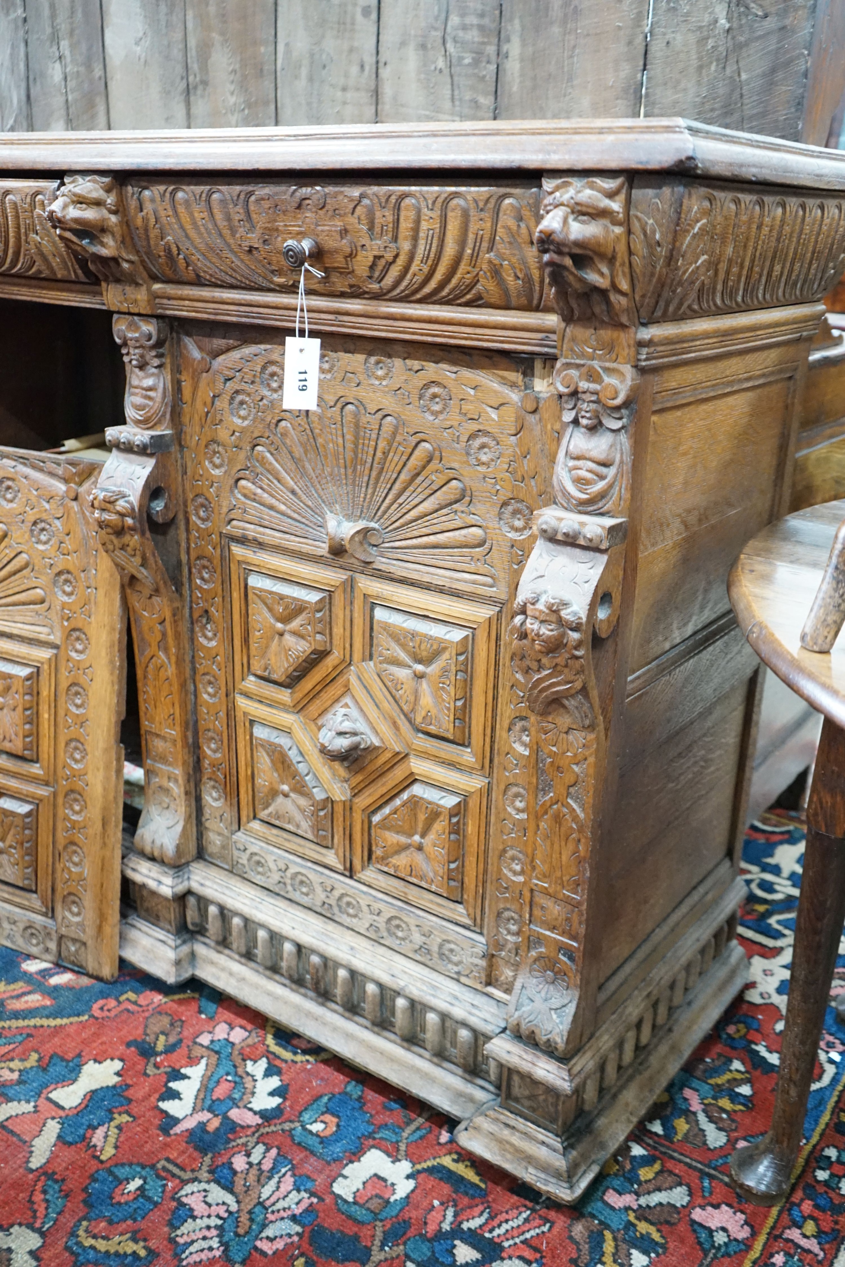 A 19th century Flemish carved oak buffet, length 140cm, depth 55cm, height 110cm